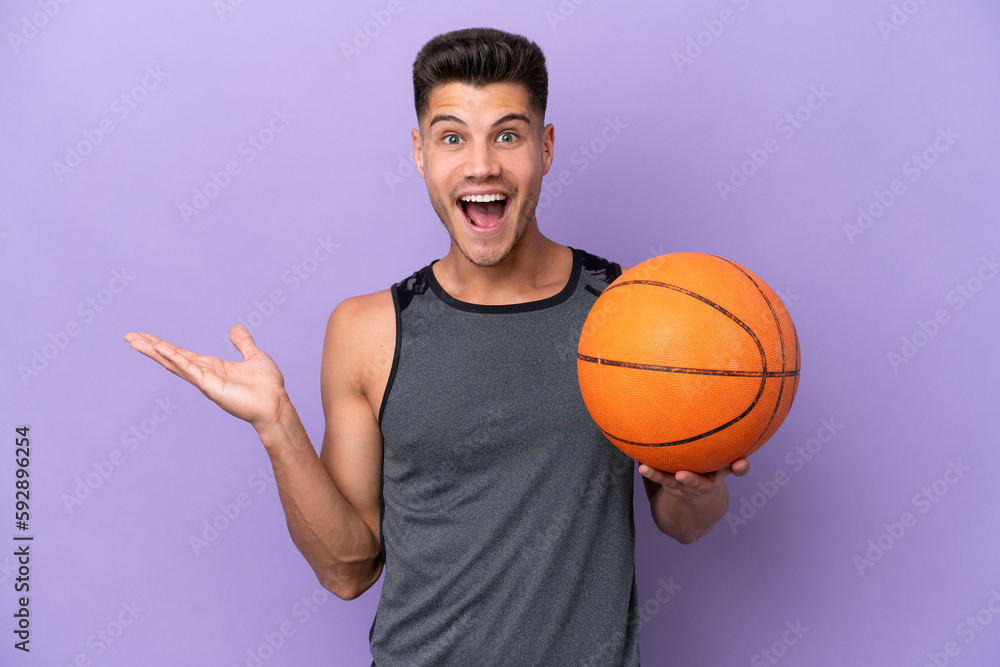 young caucasian woman  basketball player man isolated on purple background with shocked facial expression