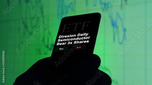 March 2023, An investor analyzing an etf fund Direxion Daily Semiconductor Bear 3x Shares. photo