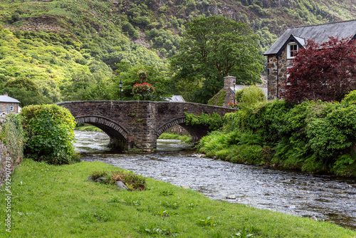 The bridge over the River Colwyn in the picturesque village of Beddgelert in the Snowdonia National Park, North Wales. photo