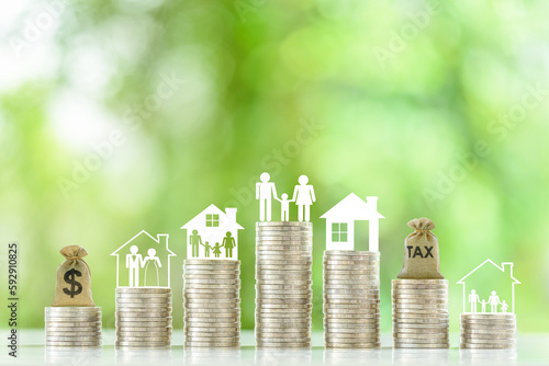 Valokuva Family tax benefit, inherit tax, property or estate and household tax concept : Tax bag, family and children, parent with 1 child, a dollar bag, married couple, home or house on top of coin stacks