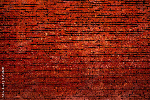 Background of old vintage dirty brick wall with Dark color, texture,reddish clayey material, hard when dry, forming topsoil in some tropical or subtropical regions and sometimes used for building