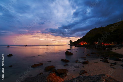 Fototapeta Naklejka Na Ścianę i Meble -  Beautiful landscape with colorful sunset on the sea rock beach.