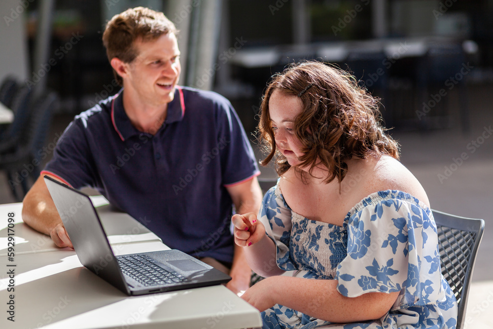 Young person with a disability learning to talk with hands in AUSLAN australian sign language Young person with a disability learning to talk with hands in AUSLAN australian sign language