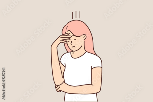 Upset woman covering face with hand in need of psychological support due to stress