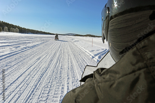 Mit dem Snowmobil auf dem Inarisee photo