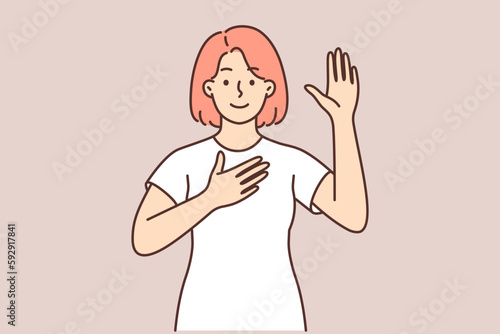 Woman promises to tell truth or takes solemn oath and swears with hand over heart and raising palm