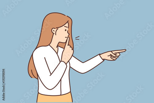 Angry woman puts finger to lips to urge quiet and not make noise during important meeting