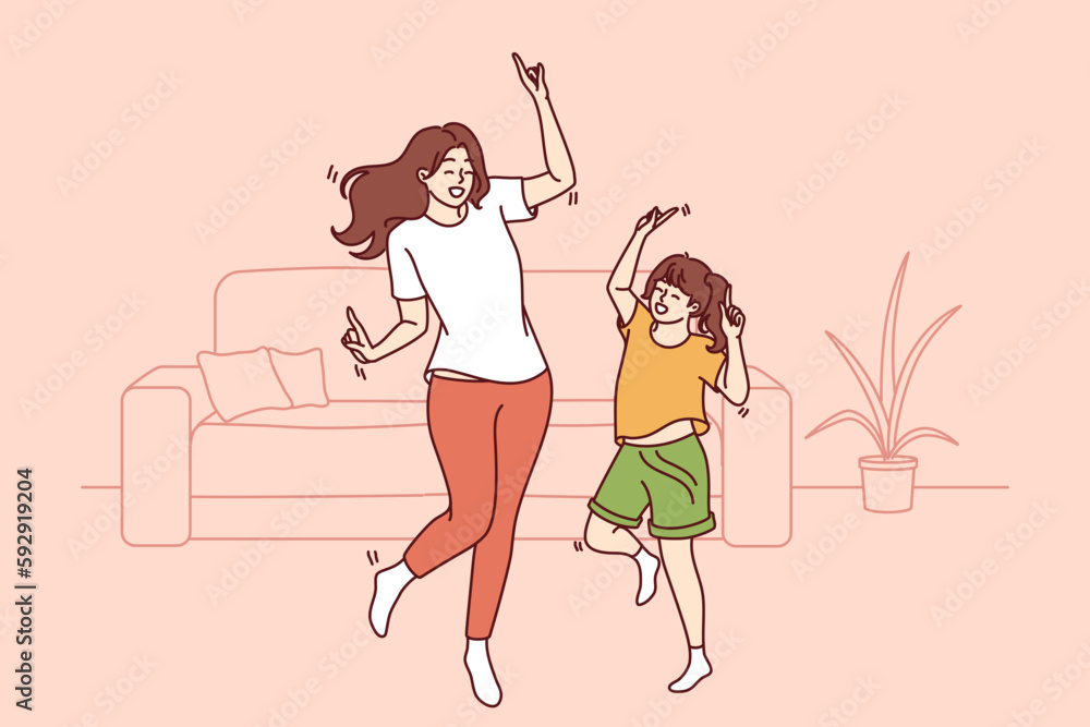 Φωτογραφία Active family of dancing young mother and daughter enjoying movement to music