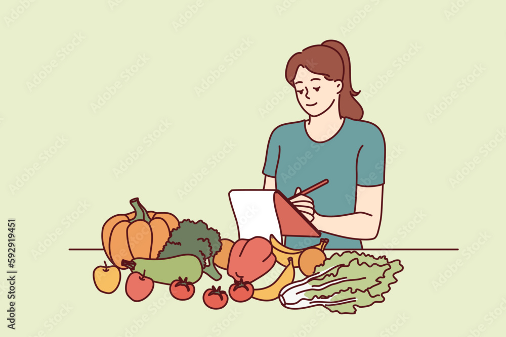 Woman nutritionist is standing near table with vegetables and making notes in notebook, making plan for new diet to detoxify body. Girl nutrition specialist uses checklist to mark diet ingredients Woman nutritionist is standing near table with vegetables and making notes in notebook, making plan for new diet to detoxify body. Girl nutrition specialist uses checklist to mark diet ingredients