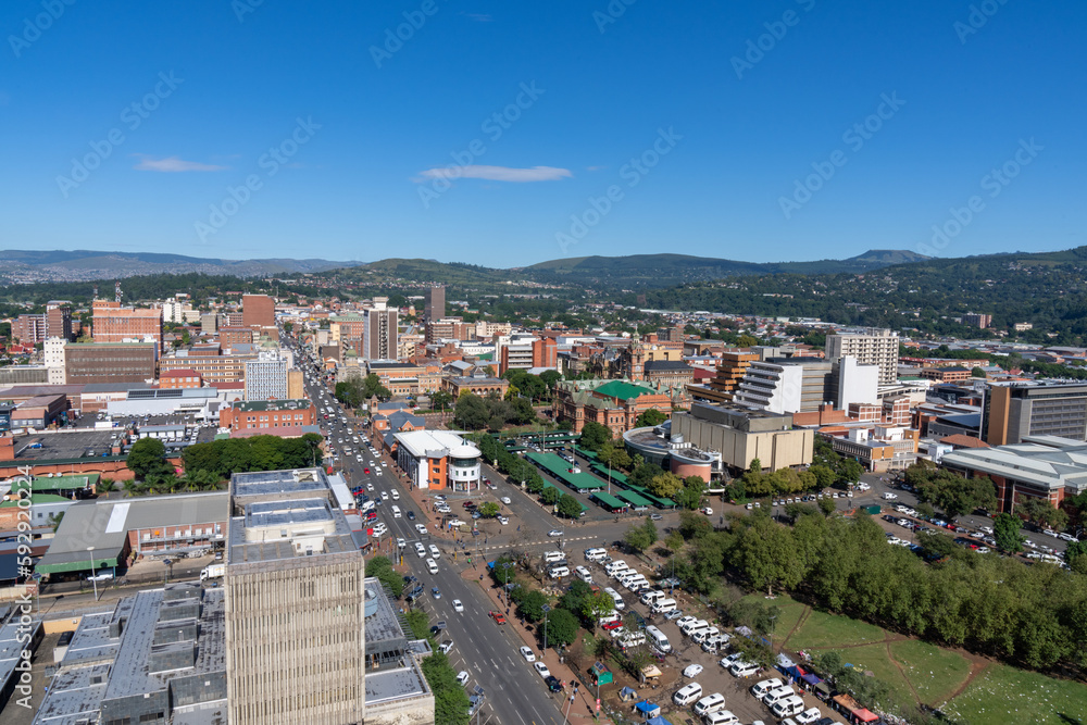 A panoramic view of downtown Pietermaritzburg, Kwazulu-Natal, with hills in the background.