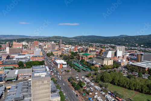 A panoramic view of downtown Pietermaritzburg, Kwazulu-Natal, with hills in the background.