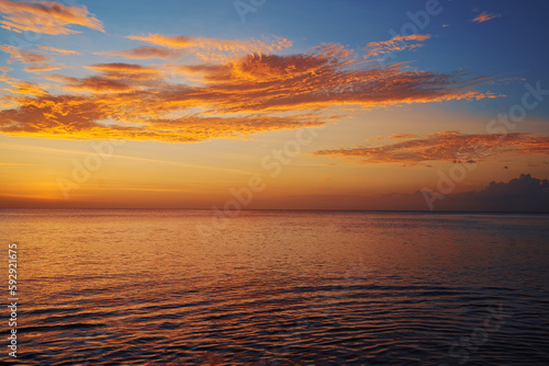 Beautiful seascape with sunset cloudy sky.