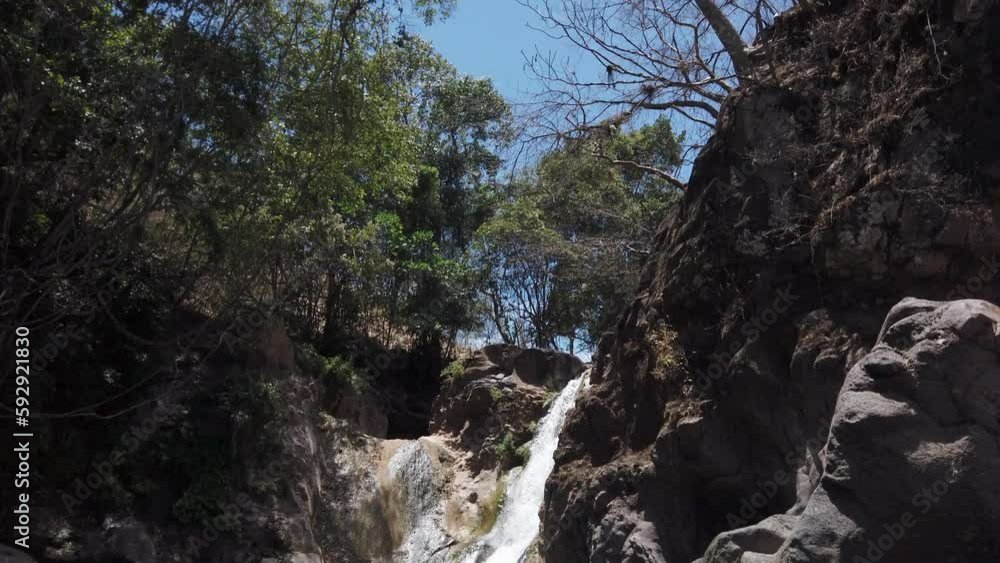 Cascada de Comala Park with green vegetation around on a sunny day in Chiquilistlan, Mexico Cascada de Comala Park with green vegetation around on a sunny day in Chiquilistlan, Mexico