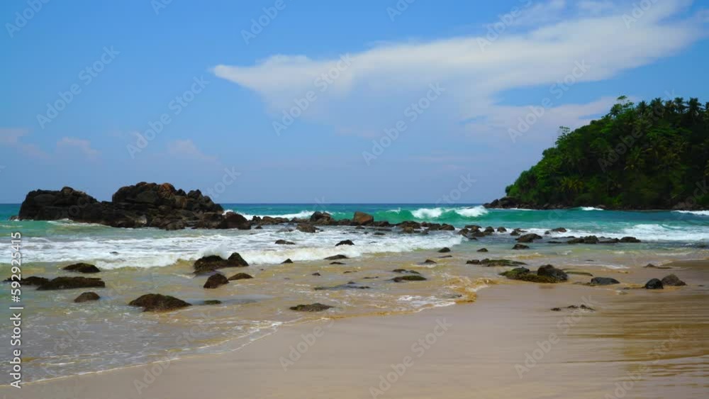Sandy ocean shore with big stones in Sri Lanka Sandy ocean shore with big stones in Sri Lanka