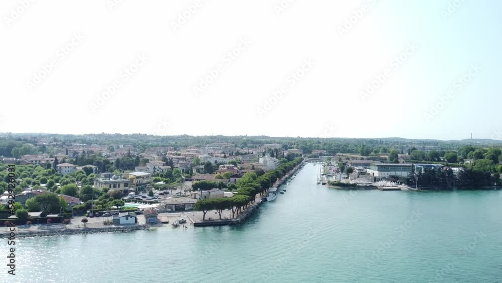 Aerial view of the beautiful teal Lake Garda and nearby shore in Veneto, Italy Aerial view of the beautiful teal Lake Garda and nearby shore in Veneto, Italy