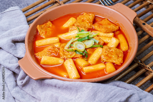 Tteokbokki, Stir-fried Rice Cake : Sliced rice cake bar (garaetteok) or thin rice cake sticks (Tteokbokkitteok) stir-fried in a spicy gochujang sauce with vegetables and fish cakes. photo