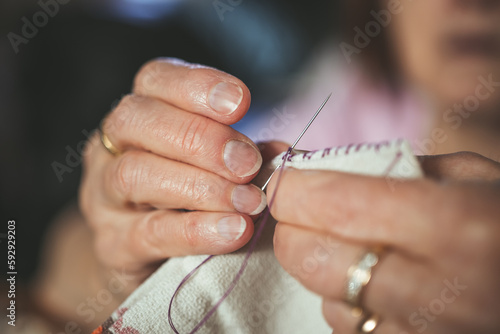 Close up of a hand with a needle