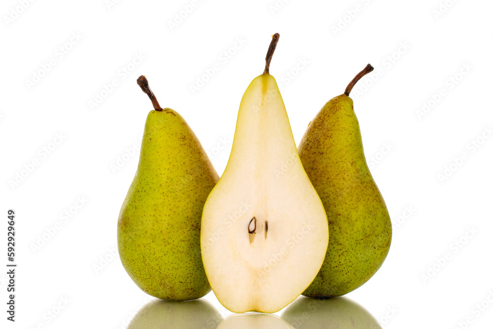 Two whole and one half ripe organic pears, macro, on a white background. Two whole and one half ripe organic pears, macro, on a white background.