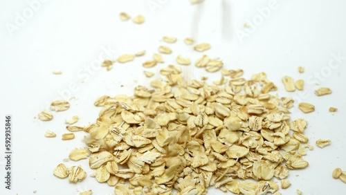 Falling Oat Flakes Rotated On White Background.
