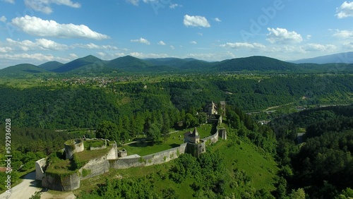Aerial view of an old castle in a mountainous landscape