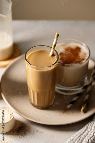 Glass of protein chocolate drink milkshake or coffee refreshing drink, moody lifestyle photo