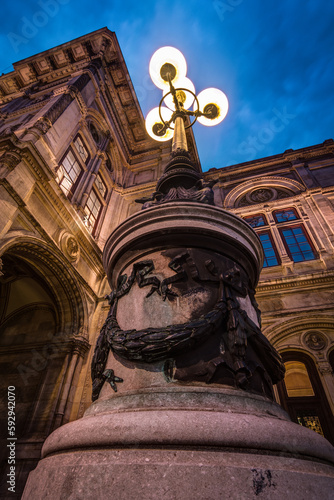 A close-up on a lamp by the historical opera house in Vienna, Austria