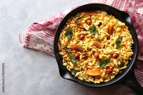 Jada Poha Namkeen Chivda or Thick Pohe Chiwda. Diwali special savory snack, made out of puffed rice, fried peanuts, curry leaves and some spices. Traditional Indian Diwali Snacks. with Copy Space. photo