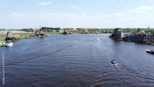 Zaanse Schans Cheese Farm Windmills Drone above River POV
