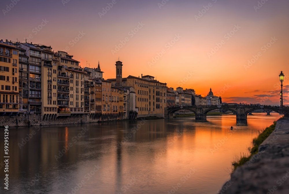 Aerial view of cityscape Florence surrounded by buildings during sunset