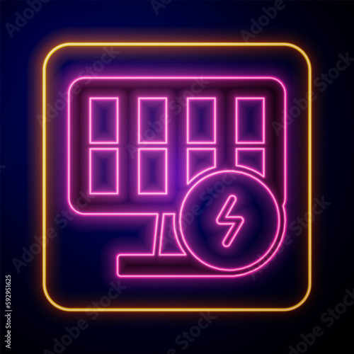 Glowing neon Solar energy panel icon isolated on black background. Vector