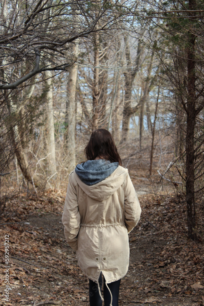 woman walking in the woods woman walking in the woods