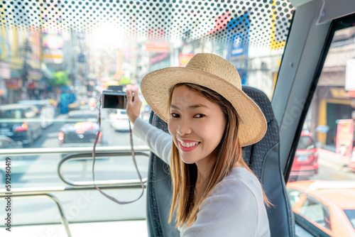 Asian woman travel and tour in Bangkok city on  yaowarat road photo