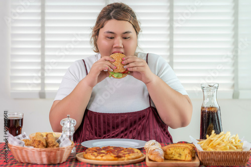 Obraz na płótnie Asian over size fat woman enjoy eating on the restaurant w salonie