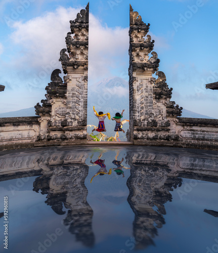 Indonesia gate in temple in Bali with indonesian woman