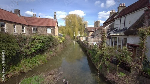 Pretty cottages and the Mells River at Nunney photo