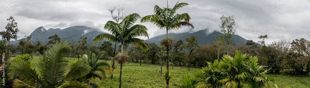 A panorama view of the cloud covered Arenal volcano on the outskirts of La Fortuna, Costa Rica in the dry season