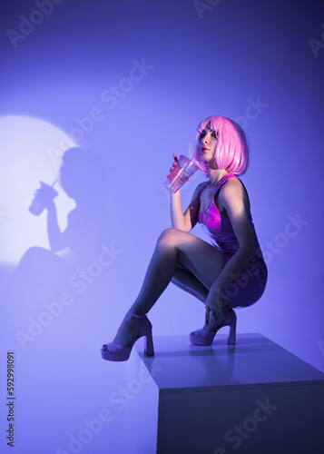 girl with pink hair in latex pink disco dress
