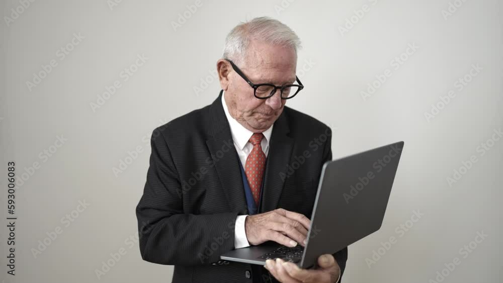 senior standing pointing to laptop over isolated white background senior standing pointing to laptop over isolated white background