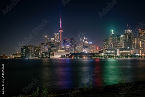 Canvas Print Image of a cityscape of Downtown Toronto during night with colorful lights and L
