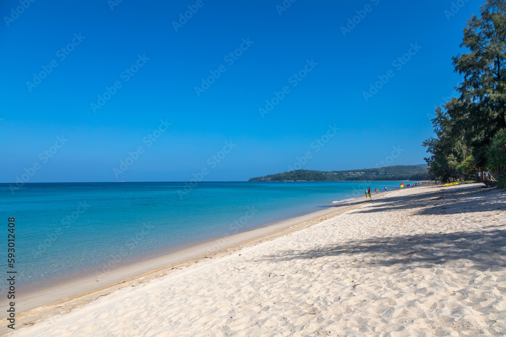 Beautiful deserted beach. Colorful sea. Blue sky. Sand on the beach. Mountains in the distance. Beautiful seascape. Beautiful deserted beach. Colorful sea. Blue sky. Sand on the beach. Mountains in the distance. Beautiful seascape.