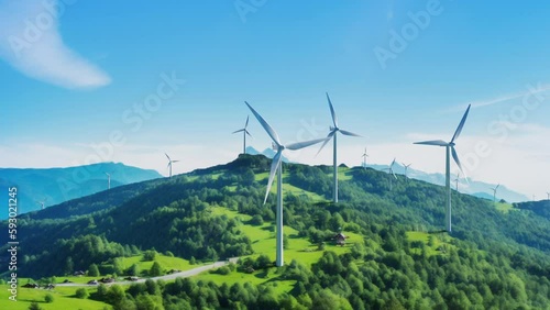 Wind power plants in the mountains. Aerial view of powerful wind turbines, generating clean renewable green energy. Slow motion video in 25 FPS, ProRes codec.