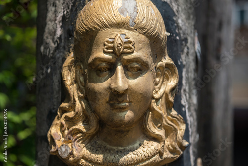 Hindu God golden Shiva Durga status attached on pillar