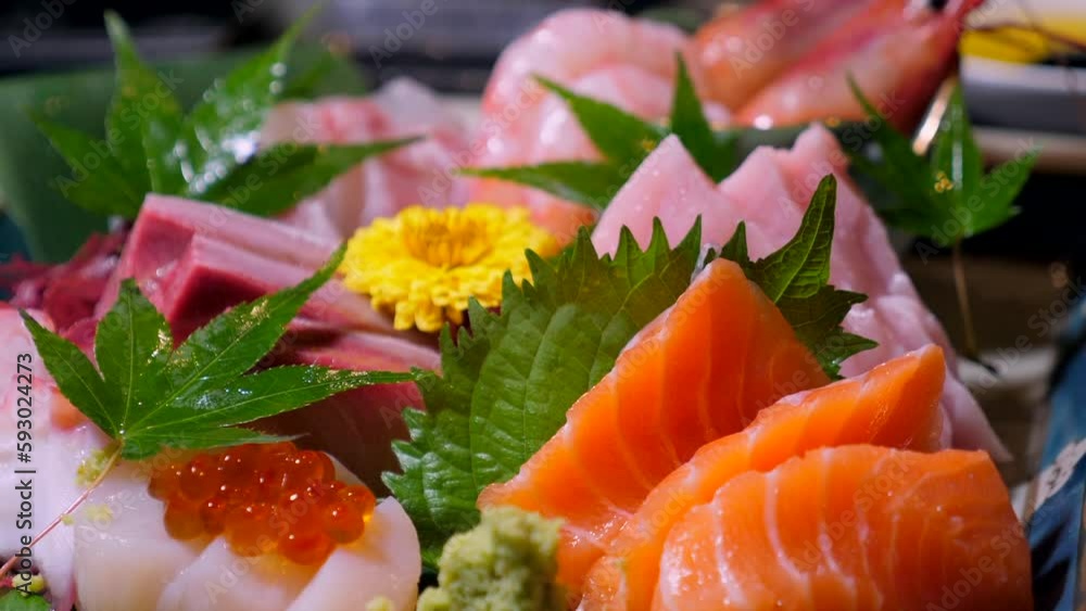 Sashimi set featuring hamachi, amaebi, and otoro. Fine dining in a