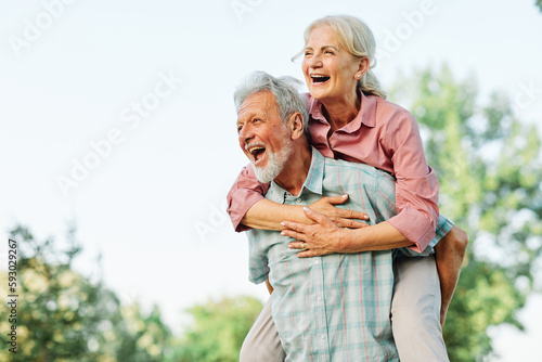 woman man outdoor senior couple happy lifestyle retirement together smiling love fun elderly active vitality nature mature portrait piggyback game