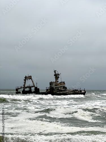 Sunken trawler, shipwreck. Old rusty metal ship Zeila at Skeleton Coast Namibia.