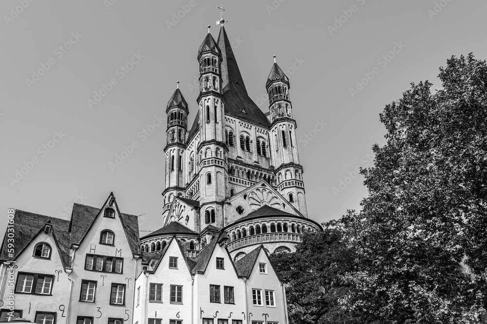 Cologne, North Rhine Westphalia, Germany: Great St. Martin church and old medieval houses in the old town of Cologne in black and white