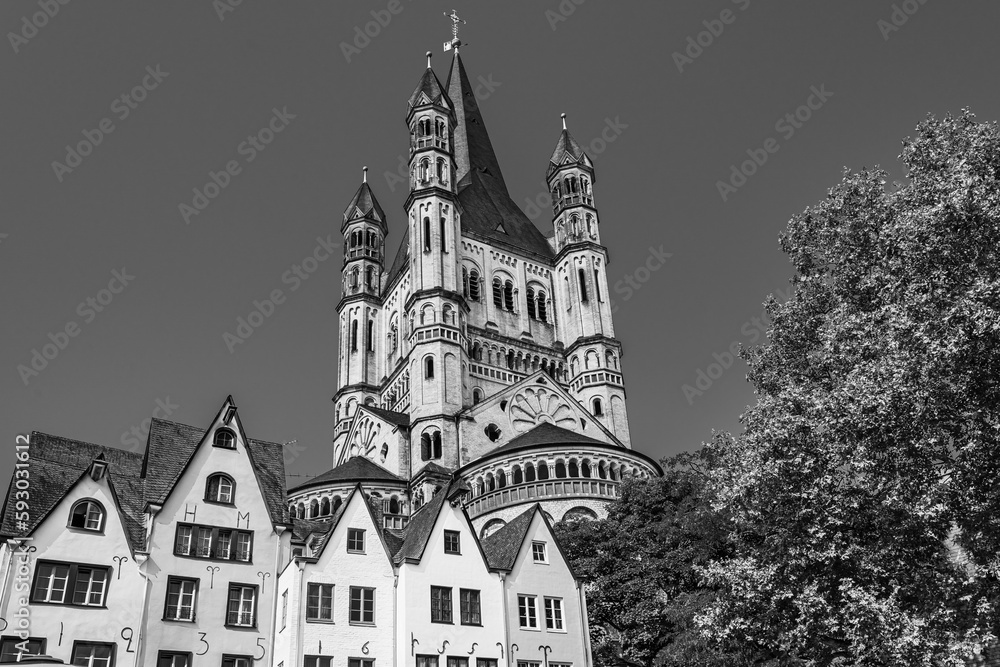 Cologne, North Rhine Westphalia, Germany: Great St. Martin church and old medieval houses in the old town of Cologne in black and white