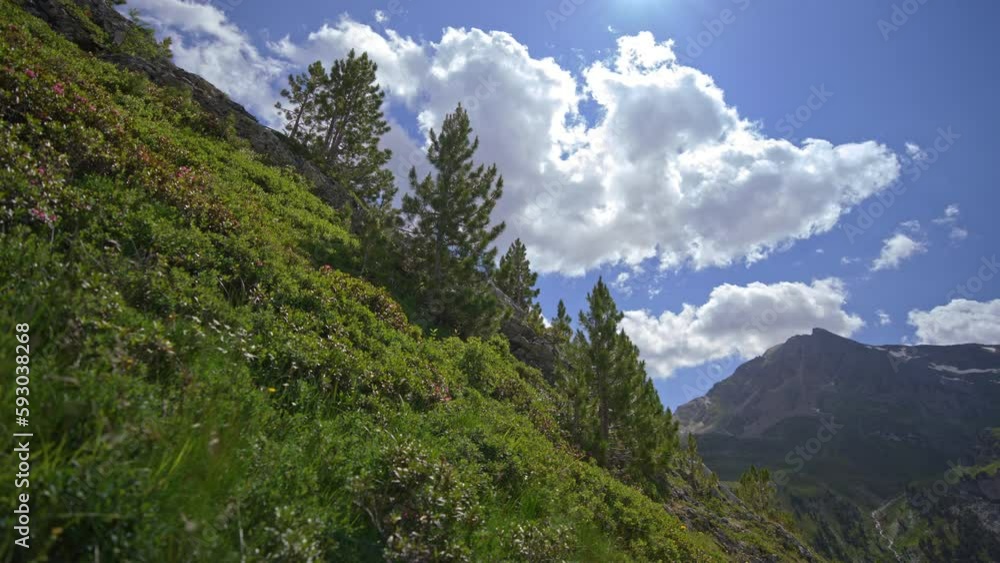 Timelapse of clouds above mountains in the French alps on a sunny day Timelapse of clouds above mountains in the French alps on a sunny day