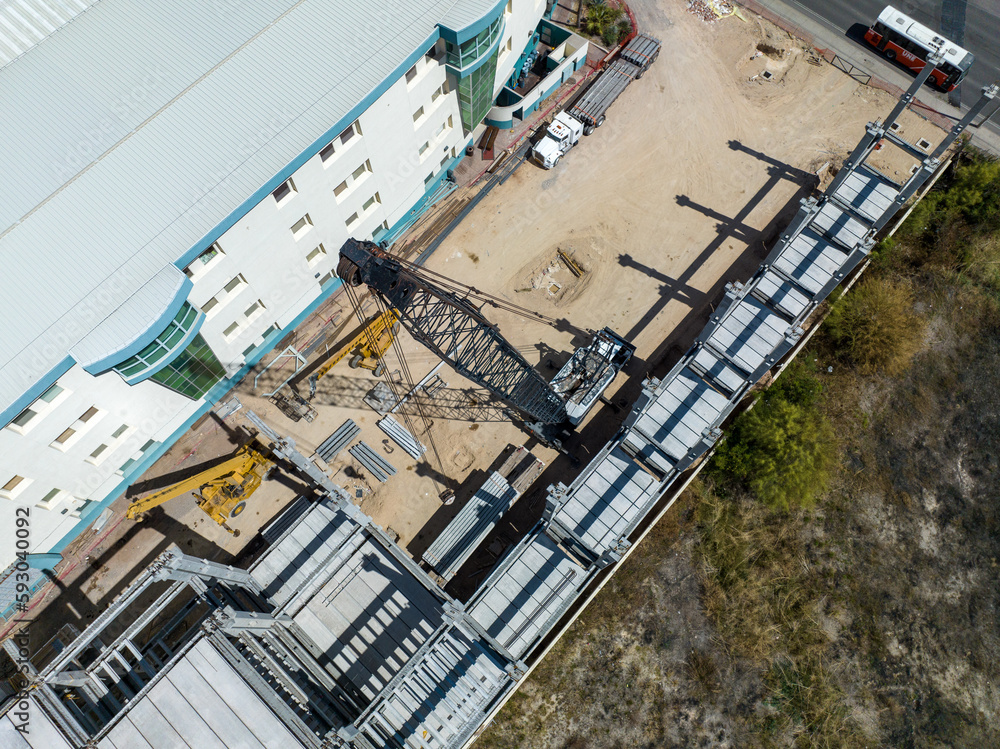 Fototapeta premium Construction crane is seen from a drone