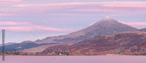 Beautiful view to Schiehallion, Scotland, with a dusting of snow under an intense evening light photo